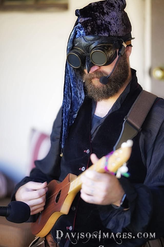 Chad Canfield performing with a stringed instrument
