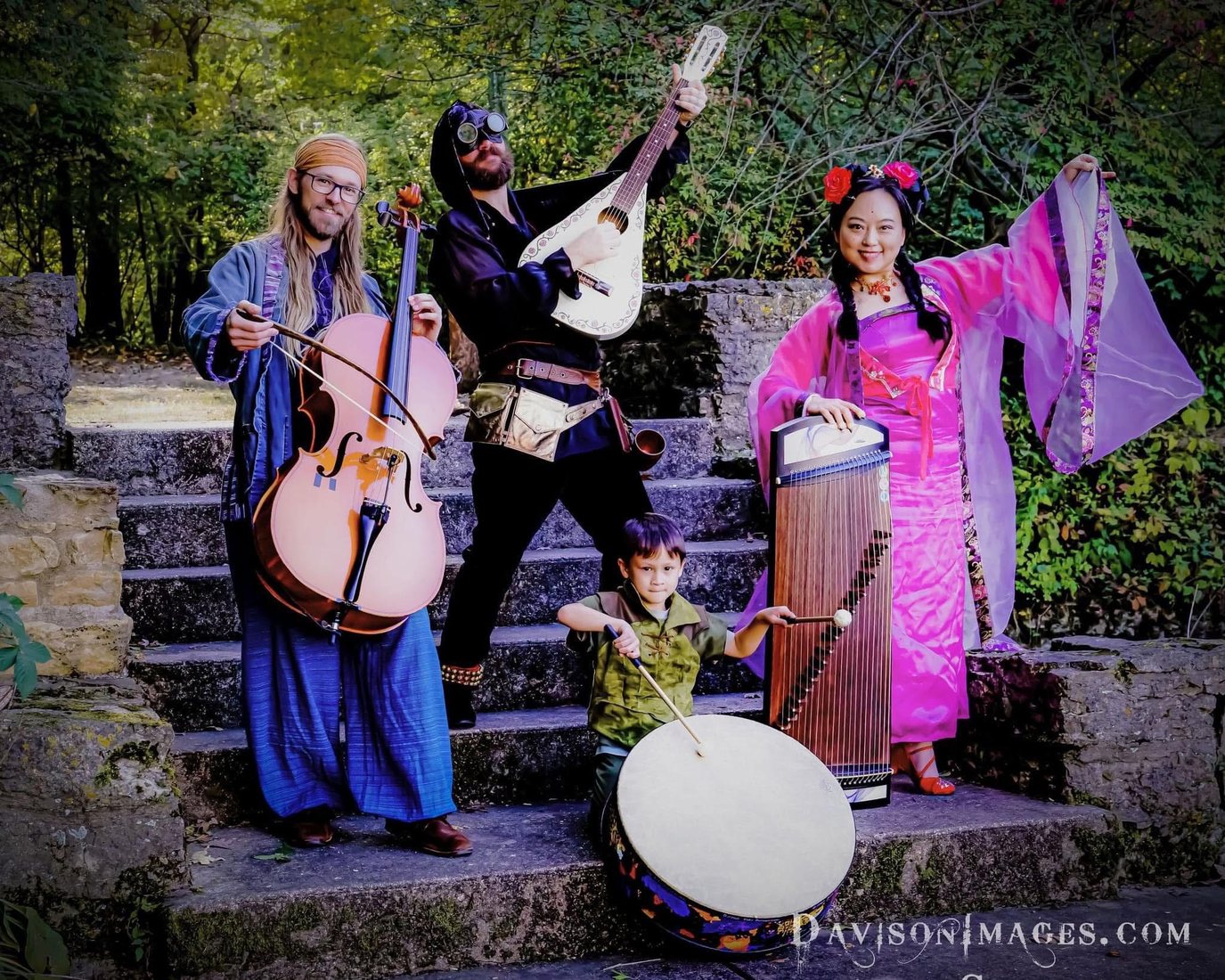 Members of Vardo posing together with instruments outdoors